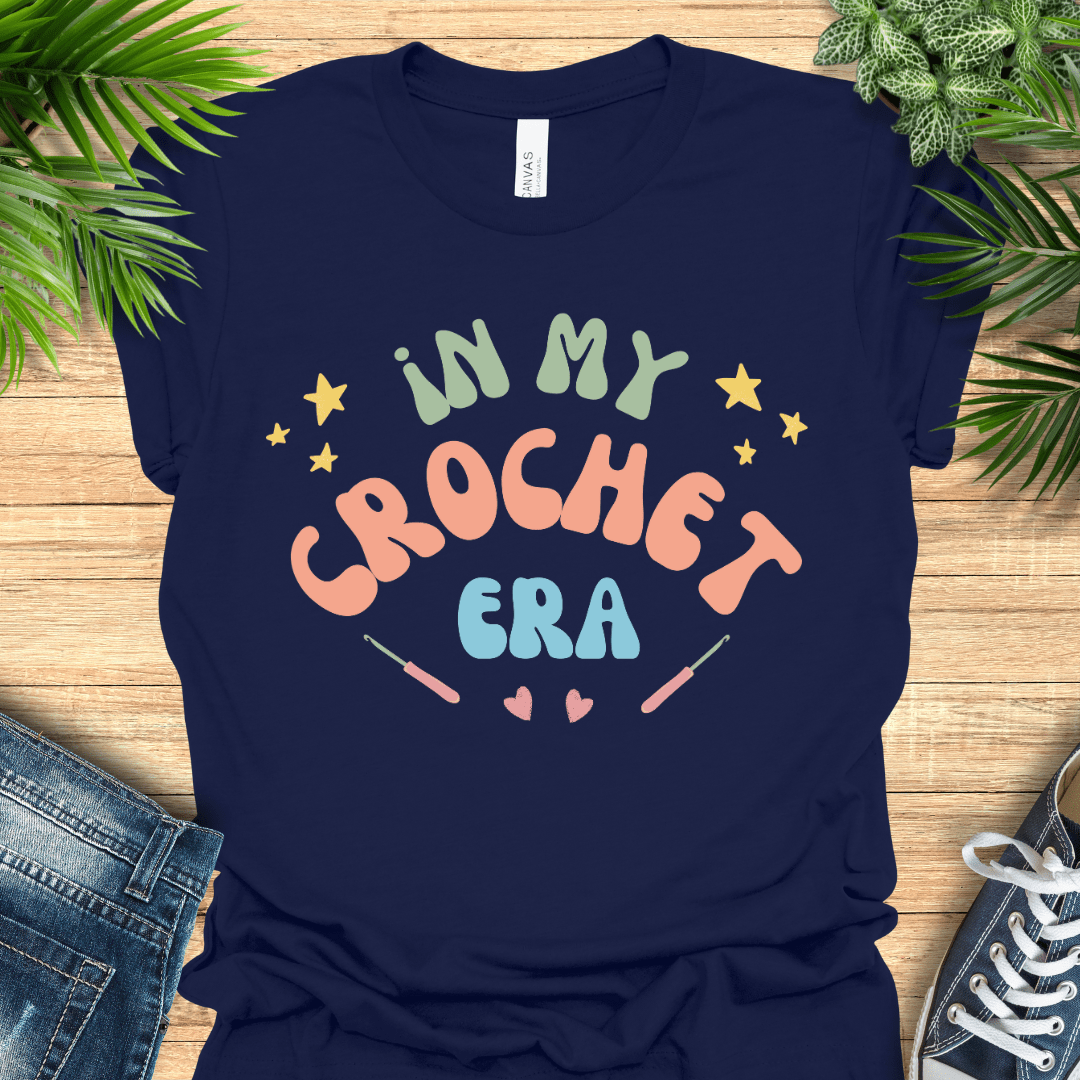 Crochet t-shirt with pastel text "In My Crochet Era", with stars and hearts, perfect for crochet fans.